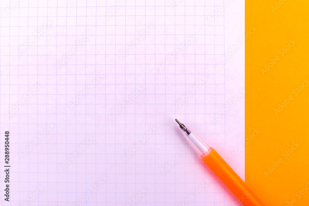 A white sheet of paper for drawings, texts, letters and notes, next to a yellow pen lies on an orange background A white sheet of paper for drawings, texts, letters and notes, next to a yellow pen lies on an orange background
