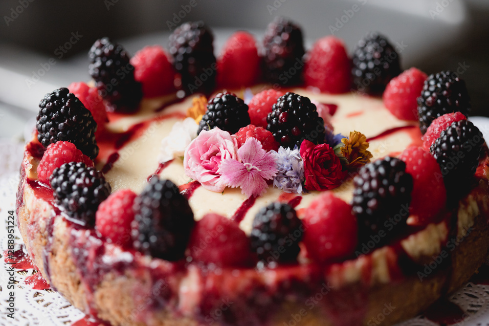fancy cheesecake with berries and flowers fancy cheesecake with berries and flowers