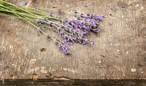 Fototapeta Naklejka Na Ścianę i Meble -  Bouquet of fresh lavender on rough wooden surface