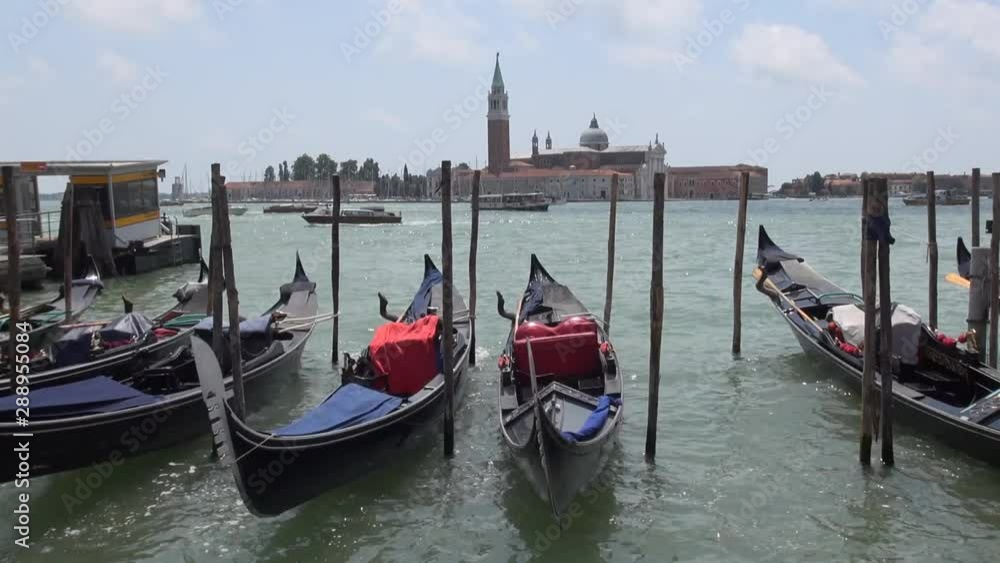 Venice, Italy: Gondolas on the Giudecca Canal , in the background the church Venice, Italy: Gondolas on the Giudecca Canal , in the background the church