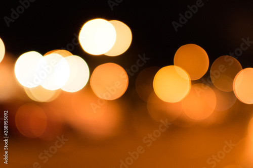 Blurred bokeh circles and colorful spots for abstract festive background.