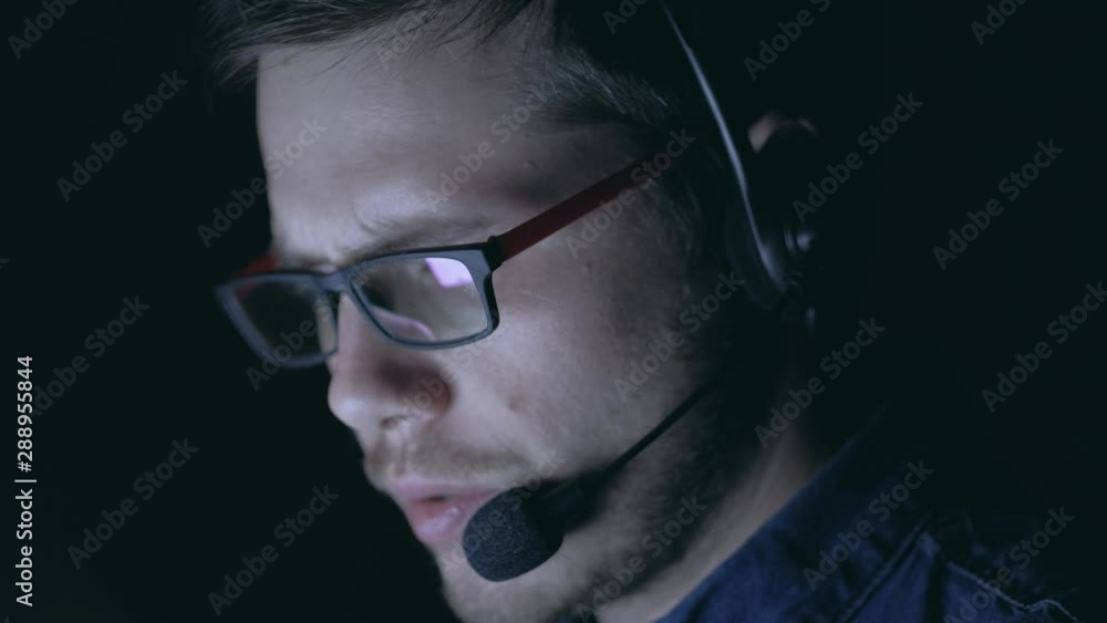 Close up - Customer service representative working at night. 4k. Remote working from home concept. Close up - Customer service representative working at night. 4k. Remote working from home concept.