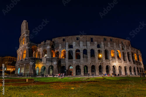 Colosseum at night with people