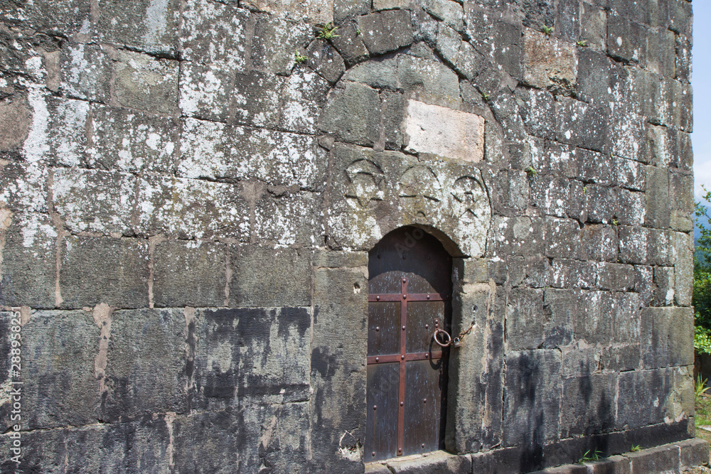 Closed Old metal, iron Door In A Wall. Doorway of a thirteenth century medieval castle