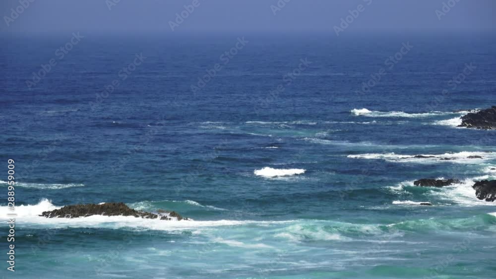 Waves and rocks in blue ocean Waves and rocks in blue ocean