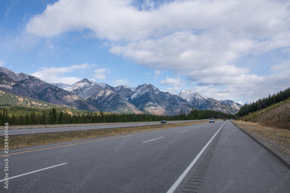 mountain range in banff national park seen from the highway, road trip Canada in fall