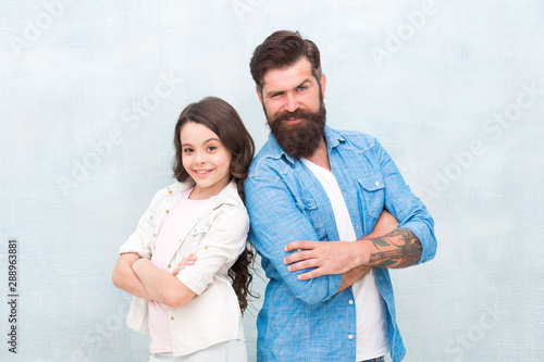 Trust and support. Best friends. Team of dad. Bearded hipster man and adorable child girl. We are team. Family team. Father and daughter teammates. Parenthood and childhood. Fathers day concept