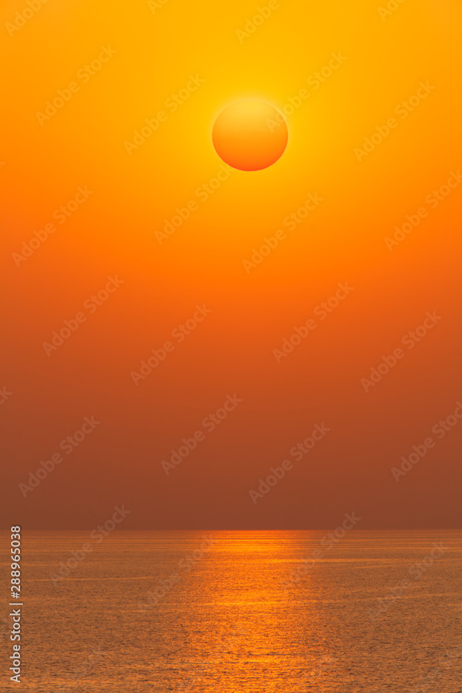 Sun disk on sunset over of the sea horizon