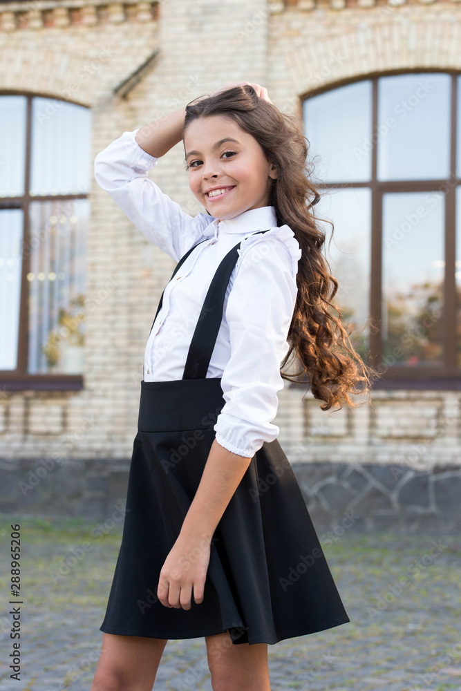 Classic style. Formal clothes for visiting school. Daily outfit. Adorable schoolgirl. Perfect matching clothes. Kids clothes. School fashion. Girl wear fashionable outfit. White shirt and black dress Classic style. Formal clothes for visiting school. Daily outfit. Adorable schoolgirl. Perfect matching clothes. Kids clothes. School fashion. Girl wear fashionable outfit. White shirt and black dress