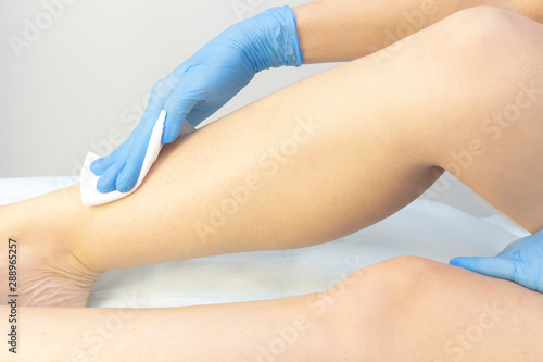 Treatment of the skin of the legs before and after the depilation procedure, shugaring, waxing. © Elena