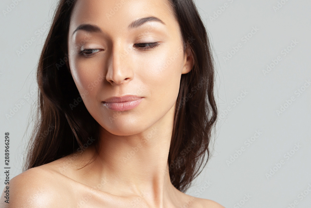 Young beautiful woman with clean perfect skin close-up. Young beautiful woman with clean perfect skin close-up.