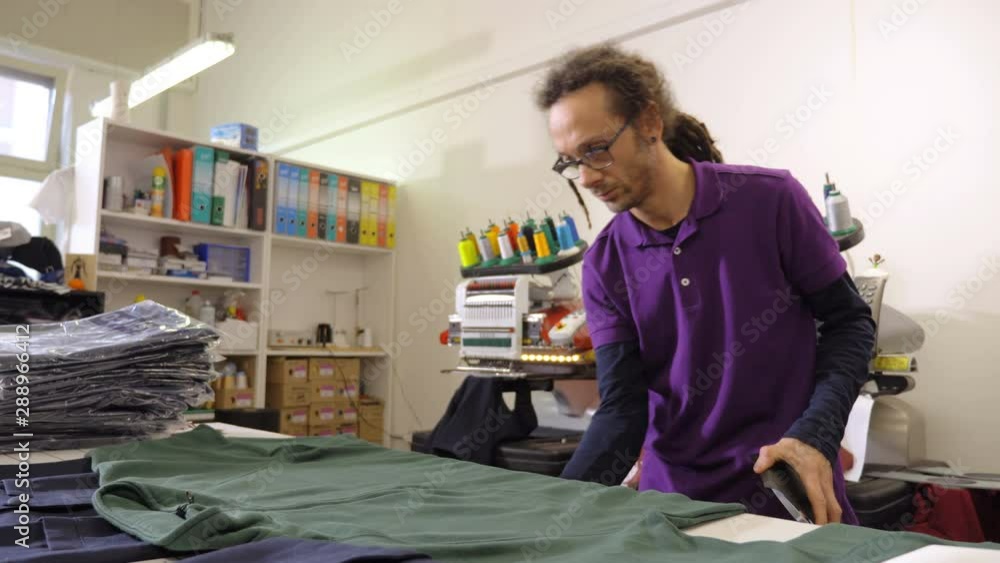 sewer applies a mold to the shirt.sewing, tailoring, creativity sewer applies a mold to the shirt.sewing, tailoring, creativity