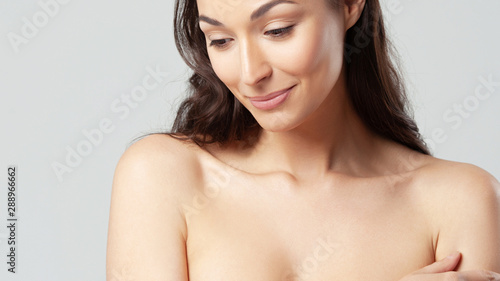 Young beautiful woman with clean perfect skin close-up.