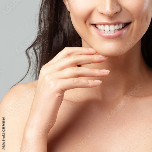 Anonymous portrait of young beautiful smiling girl. Beauty and skin care