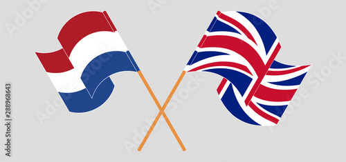 Crossed and waving flags of Netherlands and the UK