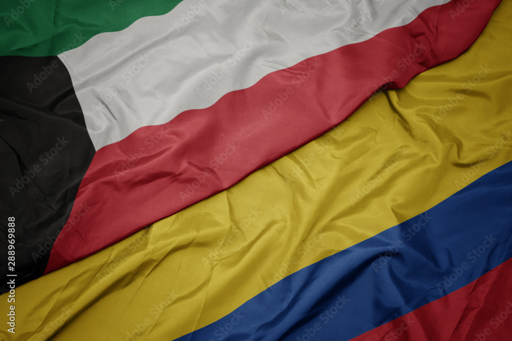 waving colorful flag of colombia and national flag of kuwait. waving colorful flag of colombia and national flag of kuwait.