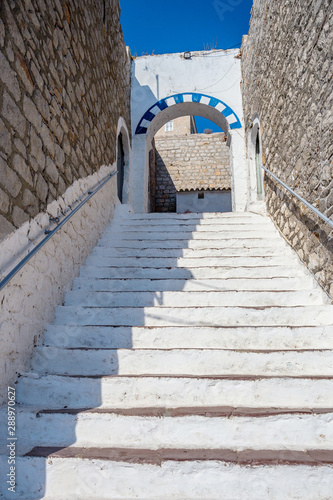 White steps. Narrow traditional white street in the town of Hydra, Hydra island, Greece