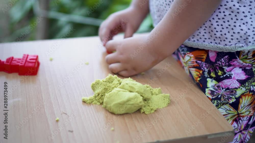 Kid is Playing With Kinetic Sand Leisure Activity Fun Kid is Playing With Kinetic Sand Leisure Activity Fun