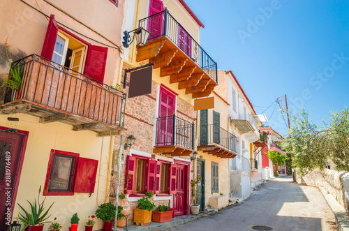 Traditional cozy greek street in city Nafplio, Greece photo