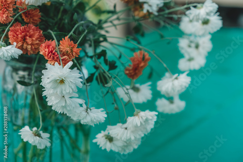 Flowers on teal picnic table