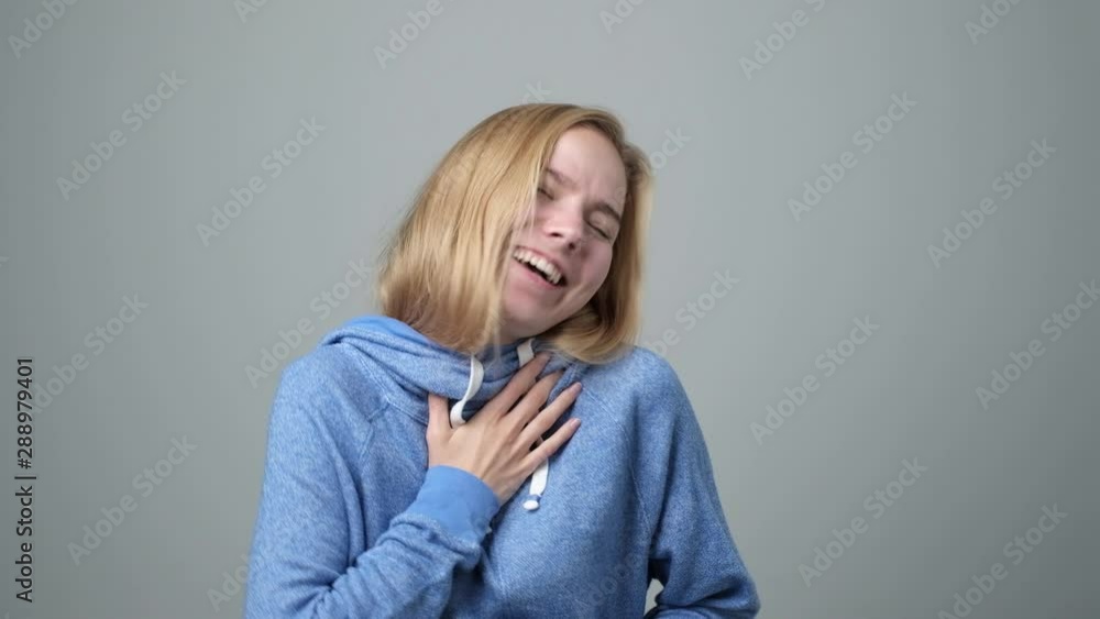 Funny cute smiling woman laughing. Positive facial human emotion. Funny cute smiling woman laughing. Positive facial human emotion.