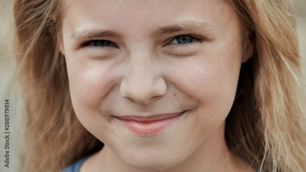 Portrait of a young smiling 11 year old girl. Face close up. Portrait of a young smiling 11 year old girl. Face close up.