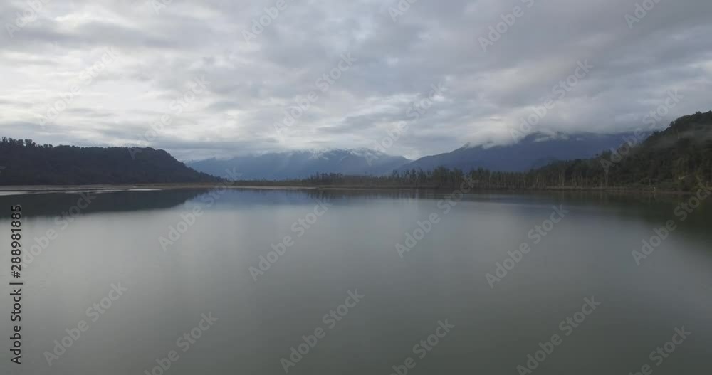 Cinematic Aerial of Lake Under Southern Alps on South Island Of New Zealand. Amazing Winter Landscape Cinematic Aerial of Lake Under Southern Alps on South Island Of New Zealand. Amazing Winter Landscape