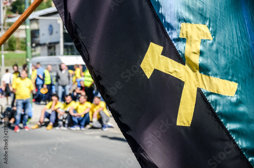 Miners strike. Miners protesting on the streets. Waving flags on march through the city center. Workers block the street in town. Demonstation to cosial rights. Protest in a front of government buildi photo