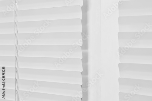 Window with closed modern horizontal blinds indoors, closeup