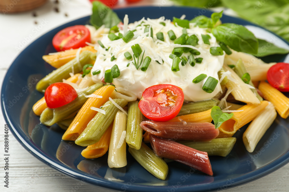 Delicious pasta with sour cream on white wooden table, closeup