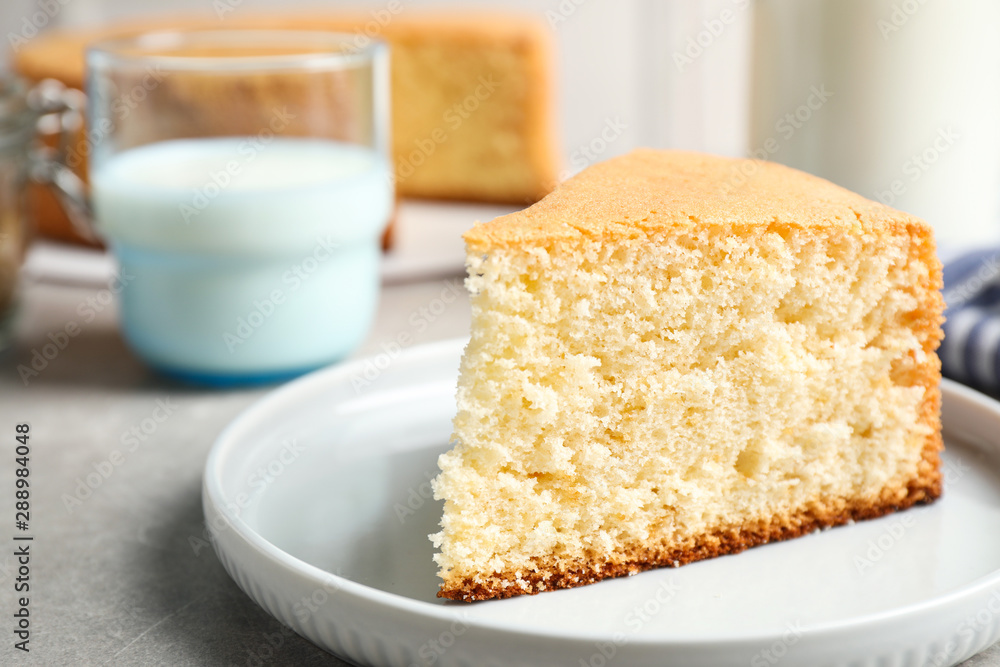 Piece of delicious fresh homemade cake on light grey marble table Piece of delicious fresh homemade cake on light grey marble table