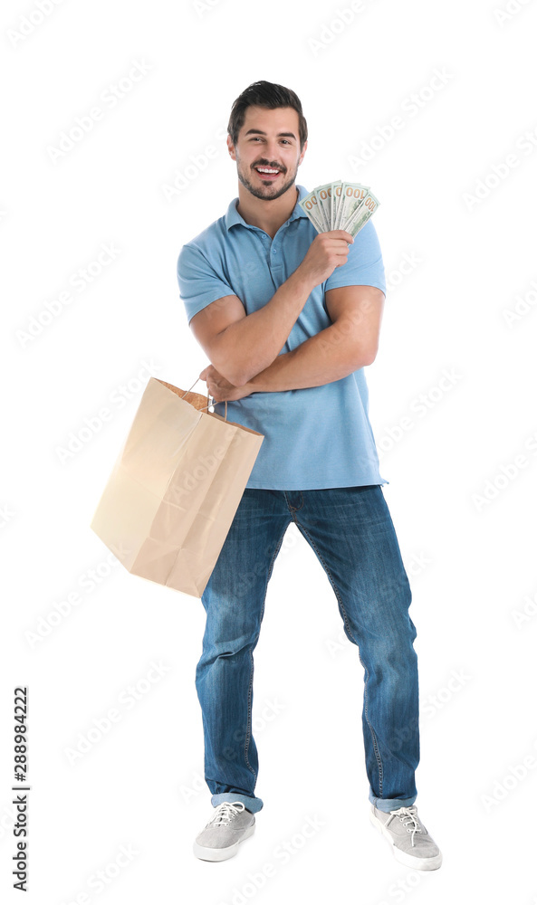 Handsome young man with dollars and shopping bag on white background Handsome young man with dollars and shopping bag on white background