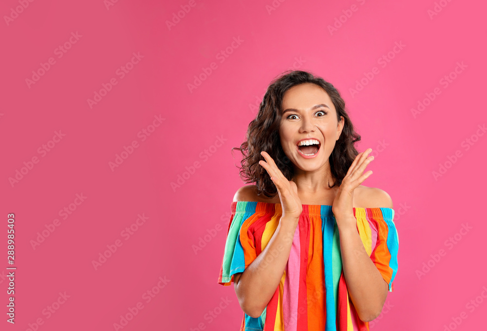 Surprised young woman in casual outfit on pink background. Space for text Surprised young woman in casual outfit on pink background. Space for text