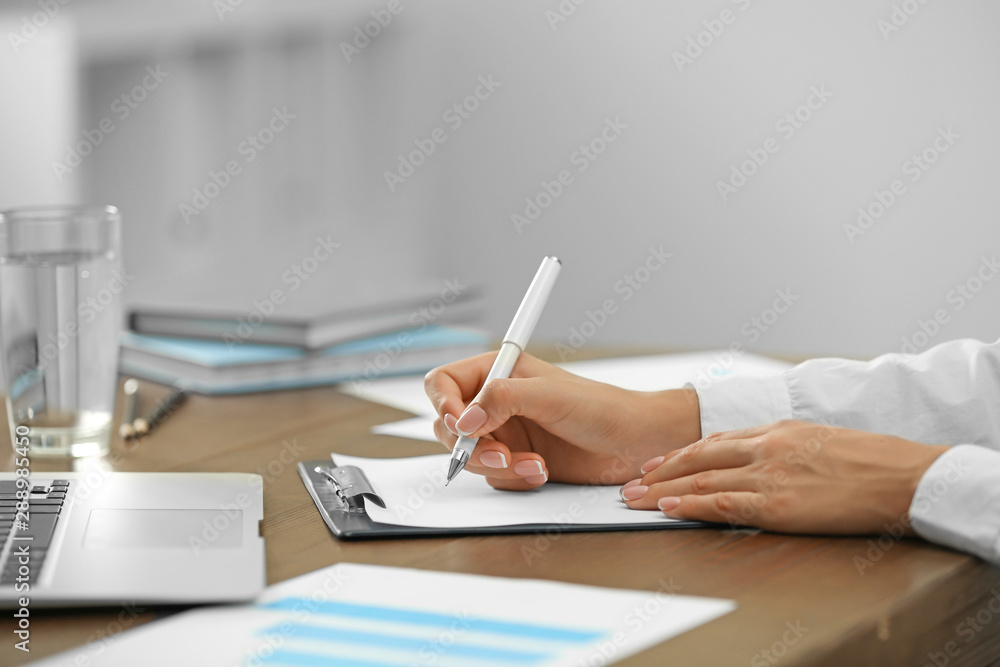 Business trainer working at table in office, closeup Business trainer working at table in office, closeup