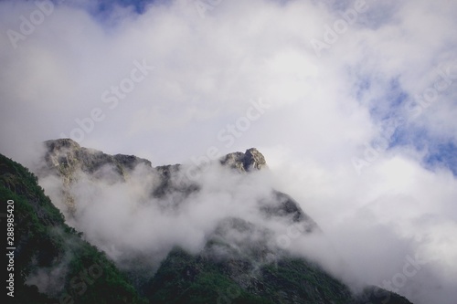 mountaintop covered in misty clouds