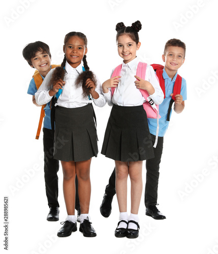Happy children in school uniform on white background