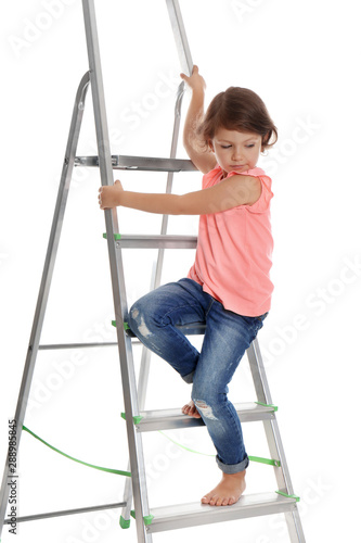 Little girl climbing up ladder on white background. Danger at home