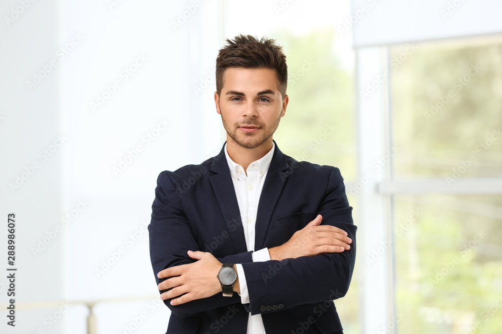 Portrait of handsome young man in elegant suit indoors Portrait of handsome young man in elegant suit indoors