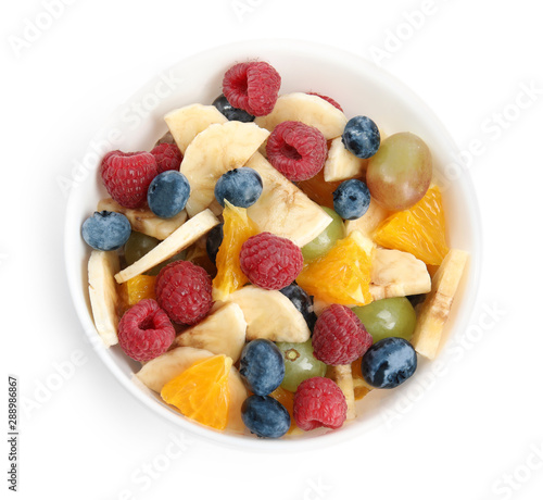 Fresh tasty fruit salad on white background  top view