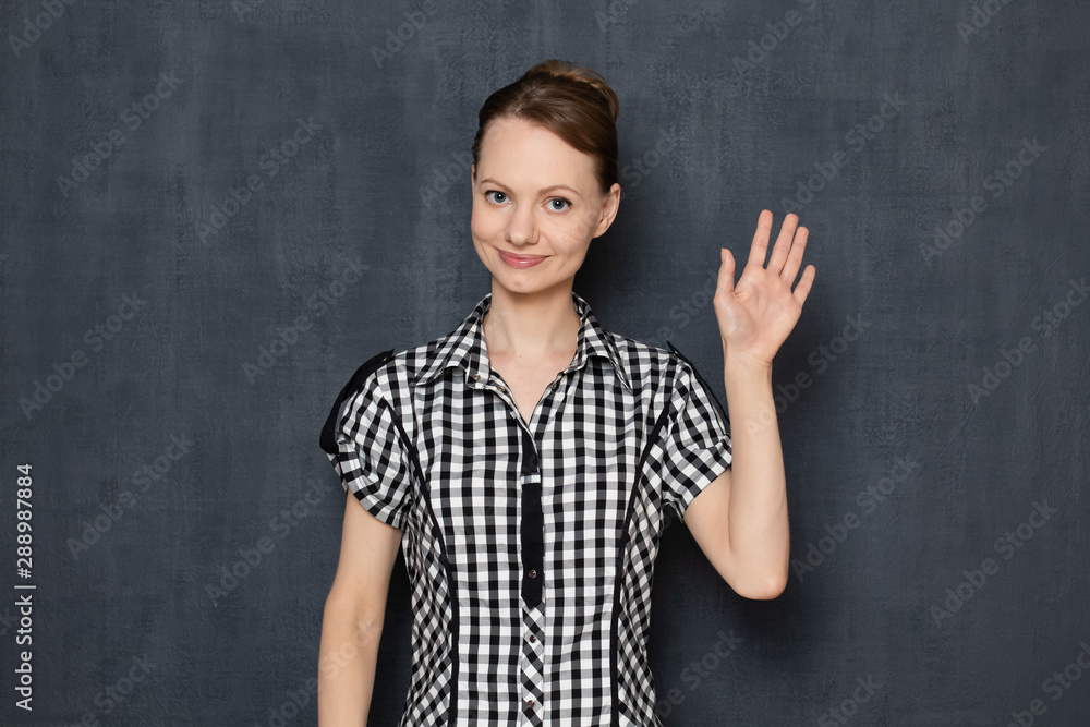 Portrait of happy girl making greeting or goodbye gesture Portrait of happy girl making greeting or goodbye gesture