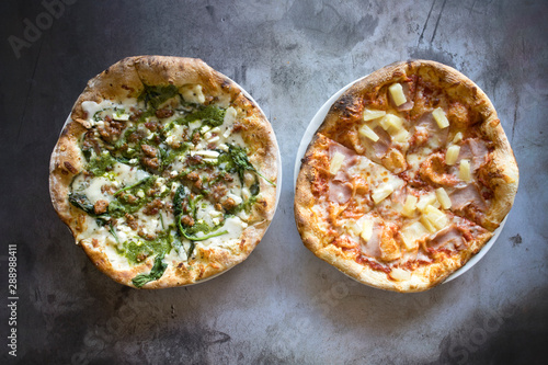 Two Pizzas on a Concrete Background