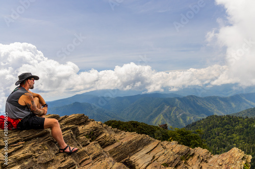 Hiker looking over Great Smoky Mountains National Park mountain range © Martina