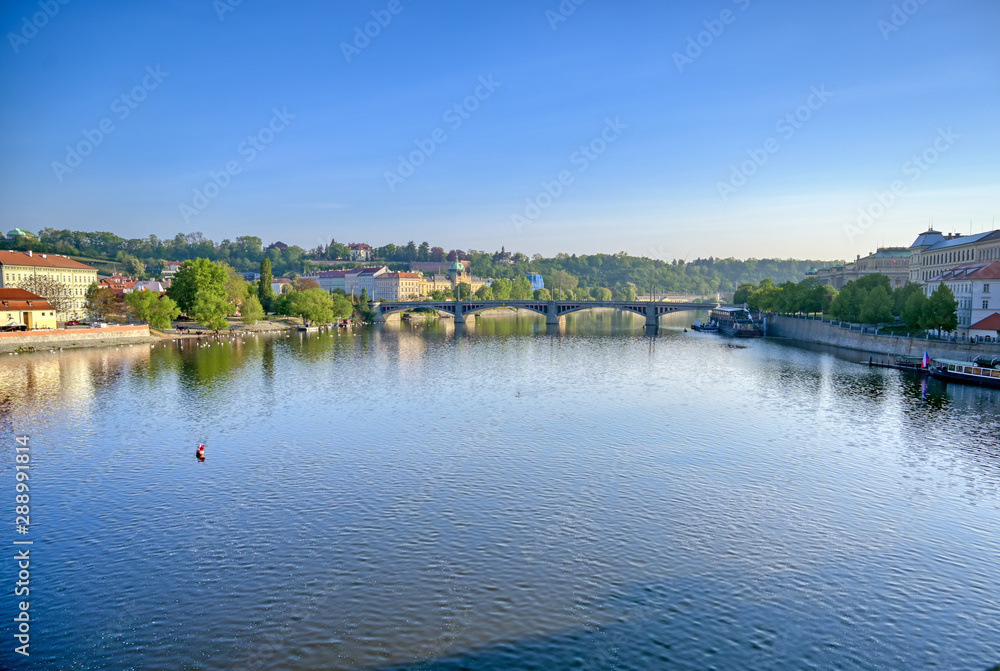Early morning view of the along the Vltava River in the city of Prague, Czech Republic.