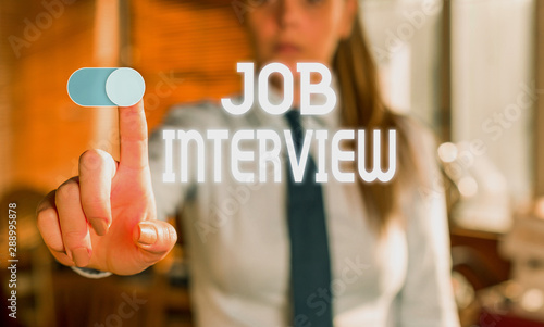 Text sign showing Job Interview. Business photo showcasing Assessment Questions Answers Hiring Employment Panel Blurred woman in the background pointing with finger in empty space photo