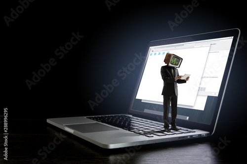 Businessman with computer head. Business efficiency concept. © Sergey Nivens