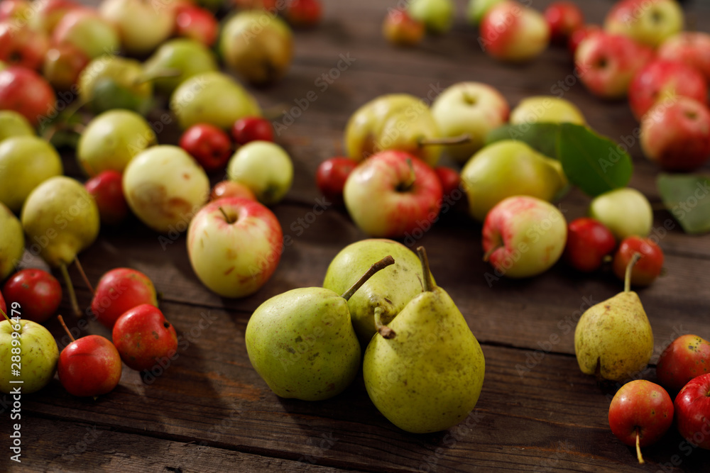 Background from ripe juicy pears and apples for your design. Close-up. Harvest. Background from ripe juicy pears and apples for your design. Close-up. Harvest.