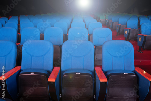 Red Blue Velvet Fabric Cloth Empty Many Seats Row Column in Movie film Theatre Concert or Siminar Conference premiere room with flare light