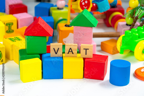 taxes or vat keyword on toy wood block