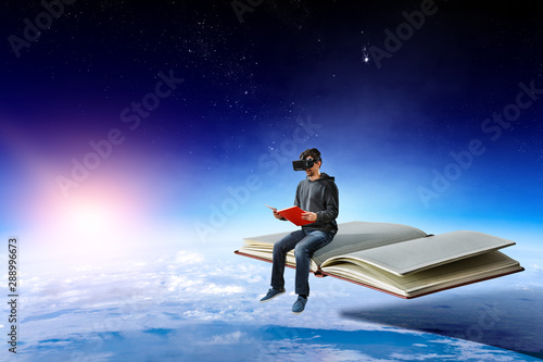 Virtual reality experience, young man in VR glasses