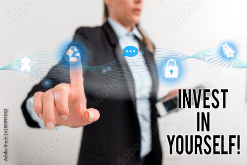 Text sign showing Invest In Yourself. Business photo text learn new things or materials thus making your lot better Female human wear formal work suit presenting presentation use smart device